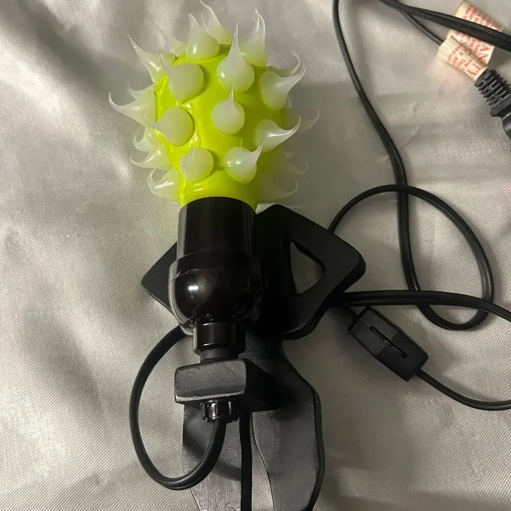 Lady shaped lamp with spikes yellow and purple light bulbs